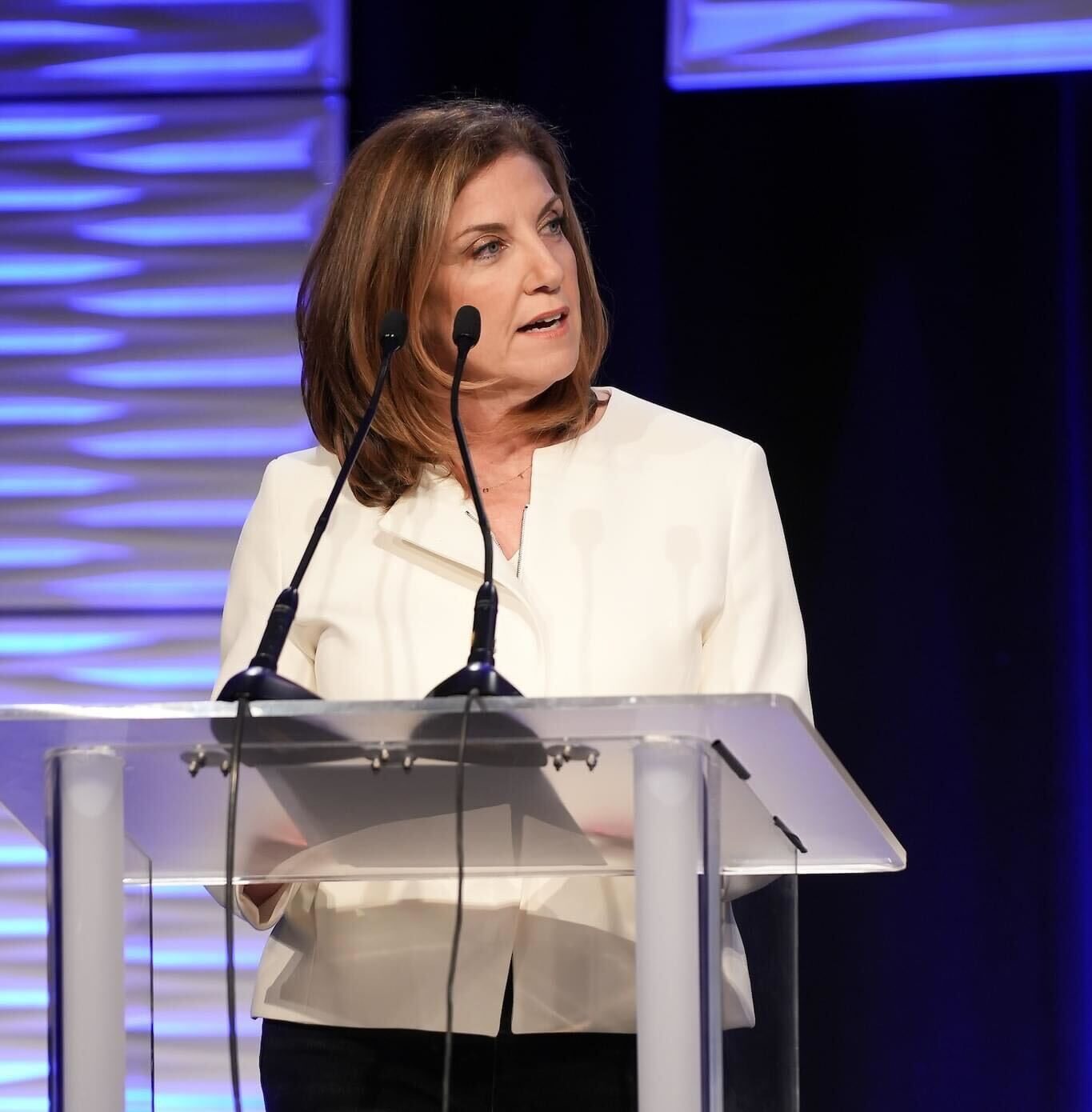 Jackie Payne presenting at a lectern